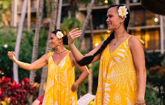 Two hula dancers performing.