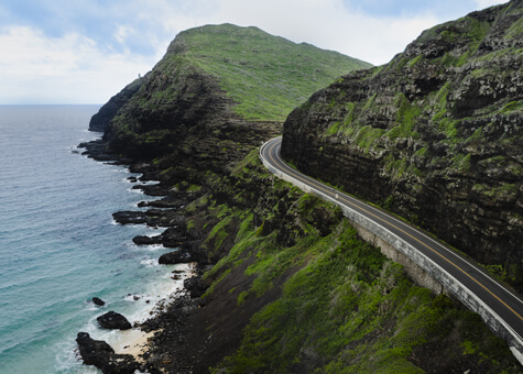 Aerial view of Kalanianaole Highway along Oahu's coast.