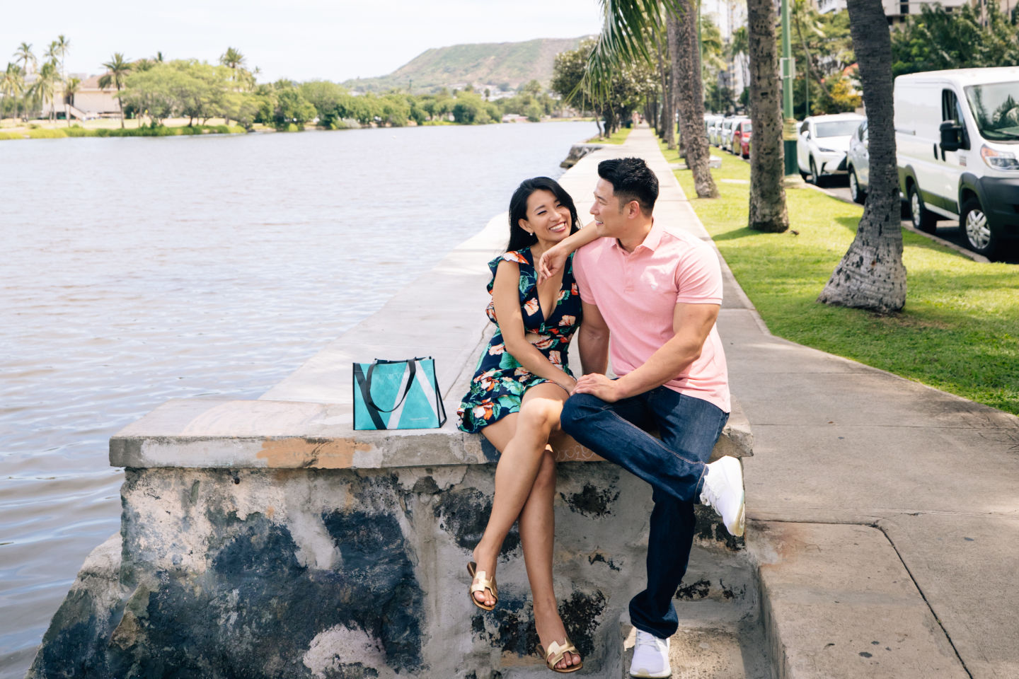 Couple sitting near the water taking a break 