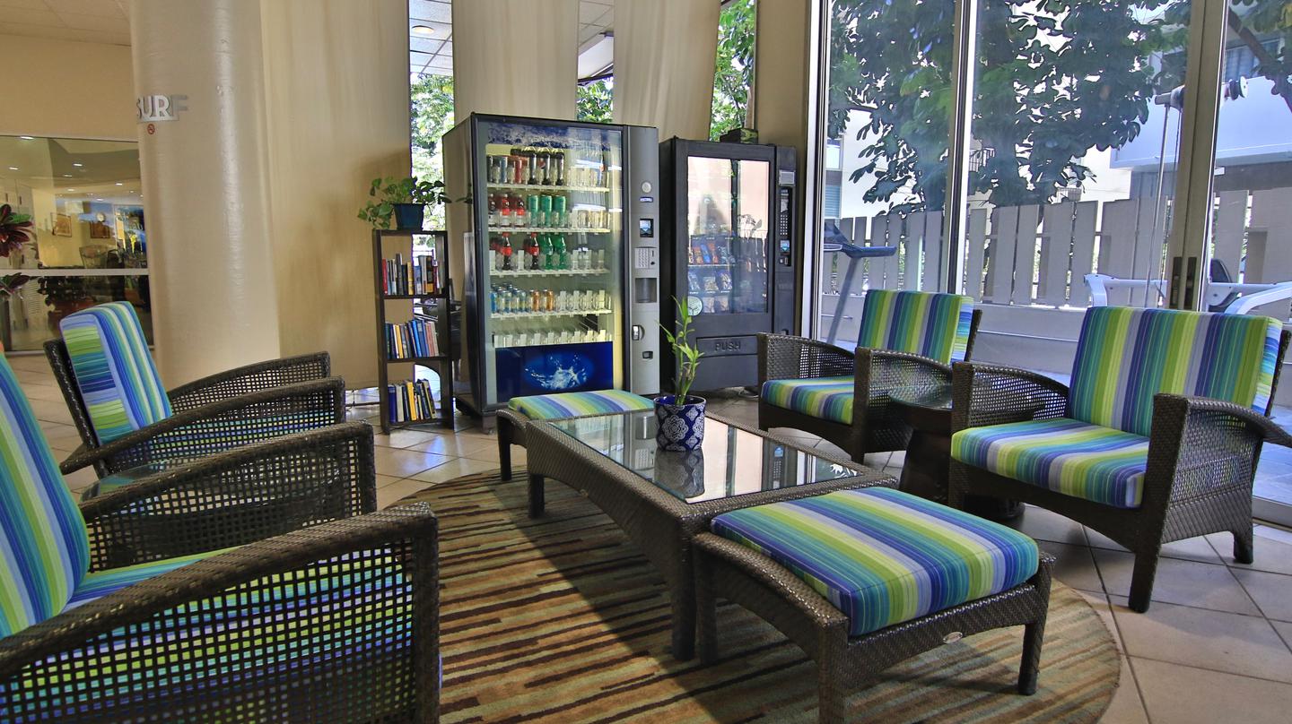 Lobby seating area with table, seating, vending machine