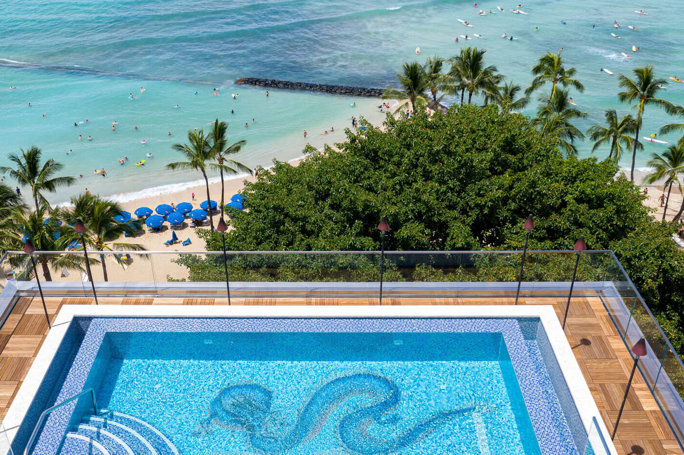 Overhead view of pool and sun deck with view of the beachfront