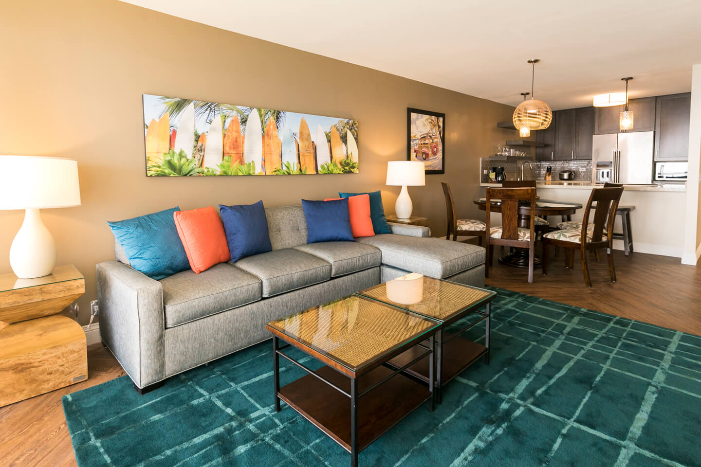 Living area and kitchen with countertop seating.