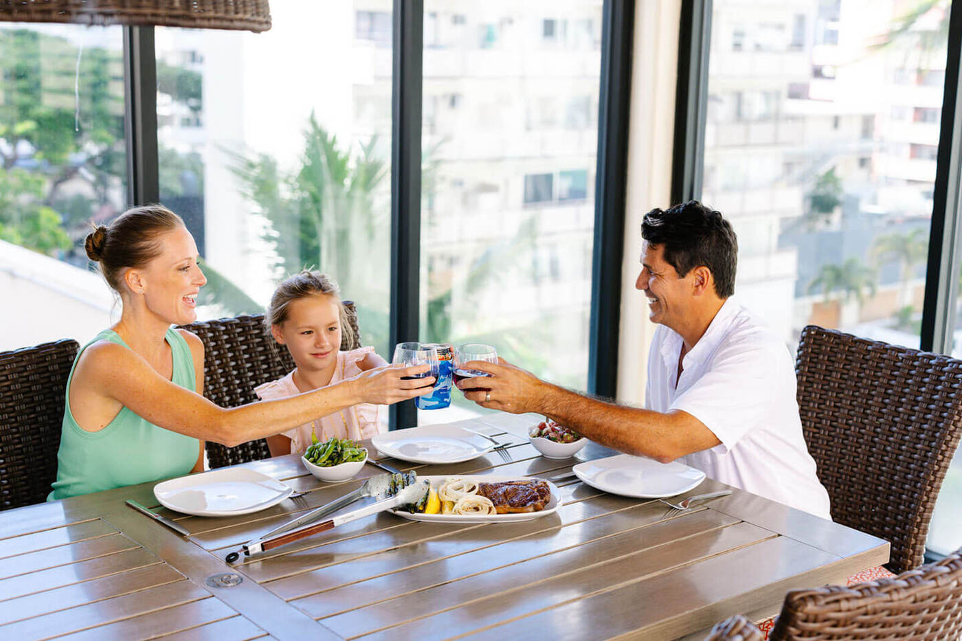 Family enjoying meal in deck dining area