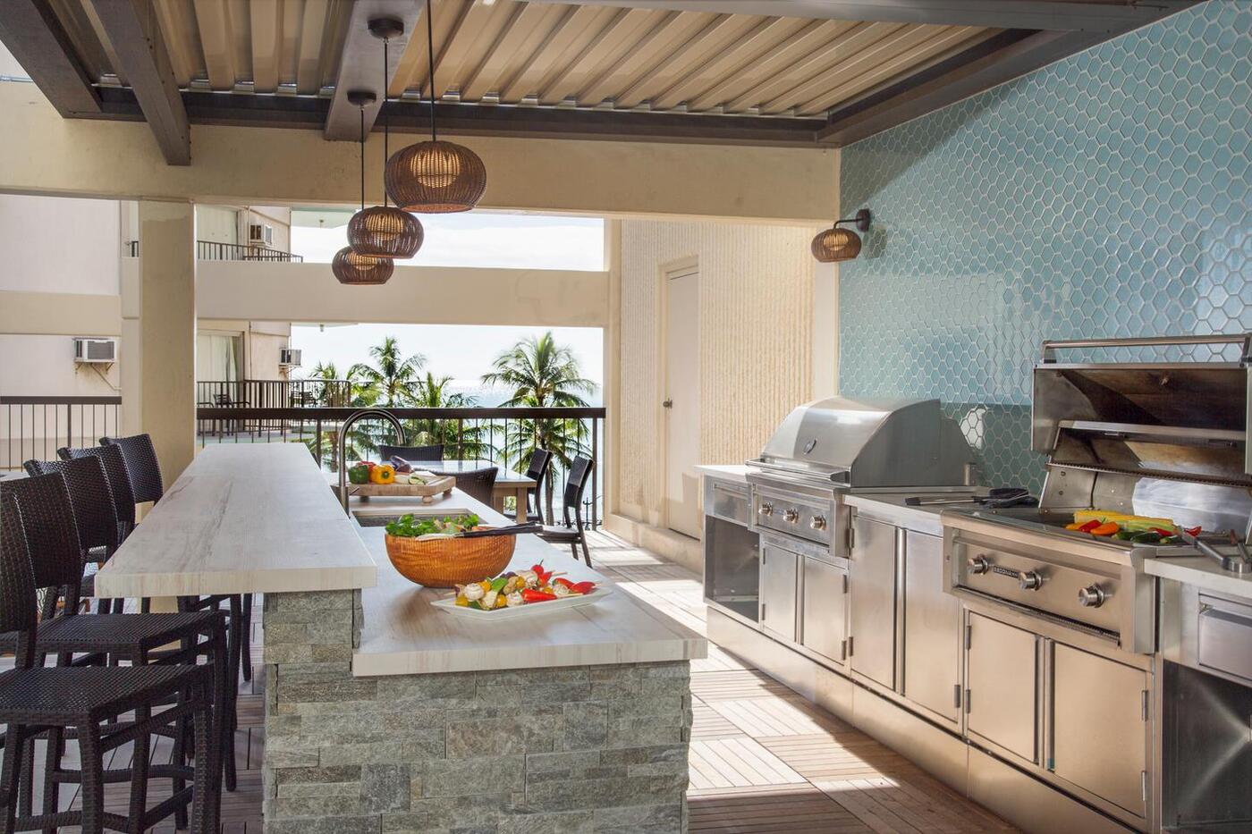 Outdoor barbecue grills, sink, and counter for dining