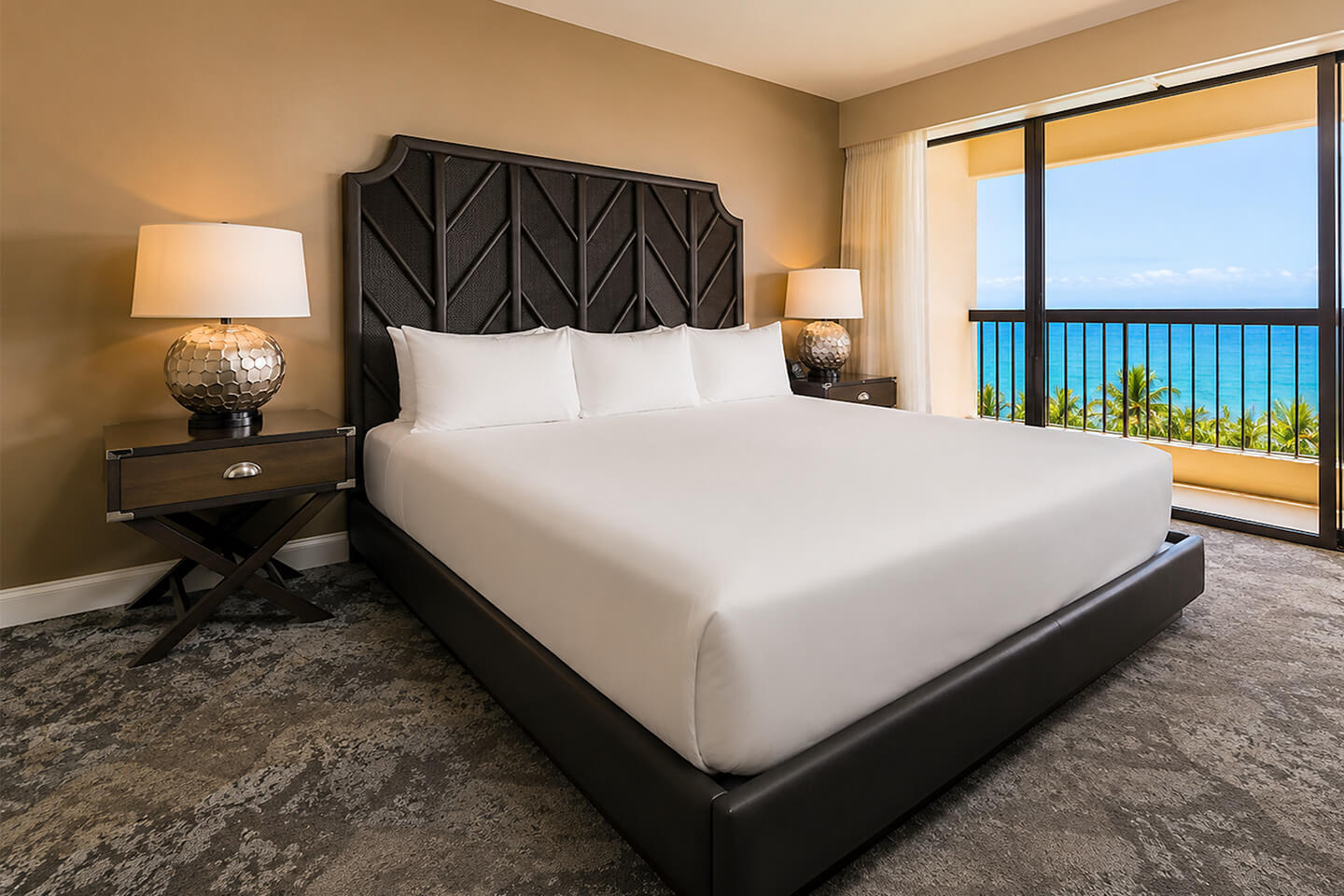 Primary bedroom with a king bed and ocean view.