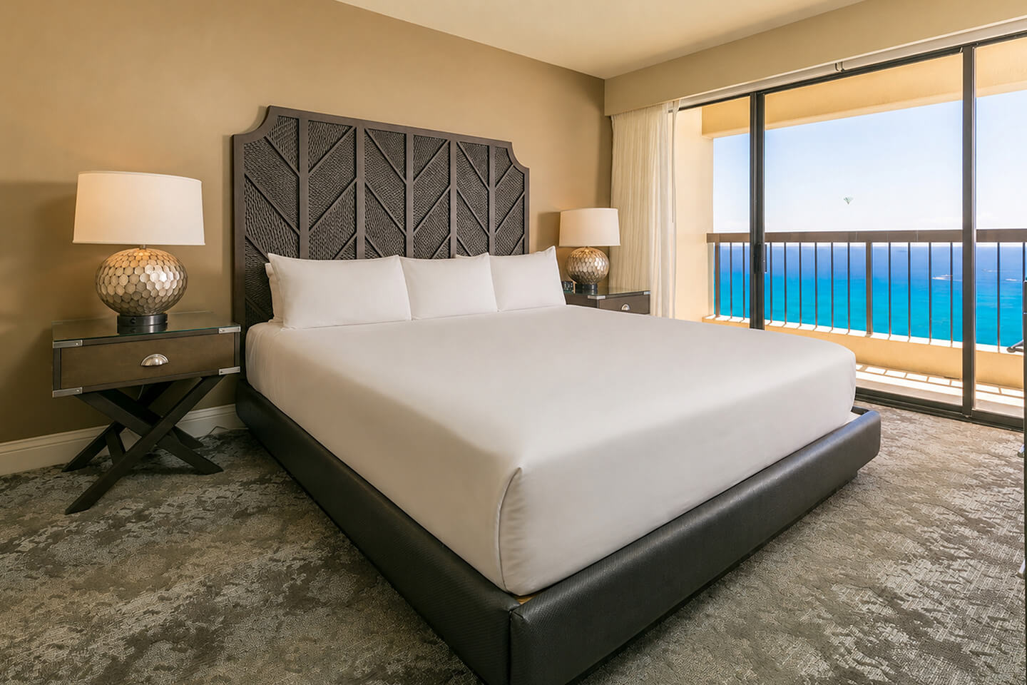 Primary bedroom with a king bed and ocean view.