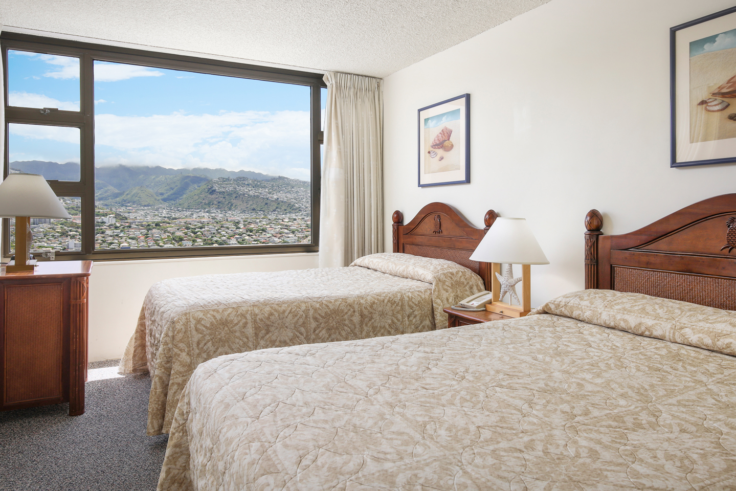 Bedroom with 2 beds and a mountain view.