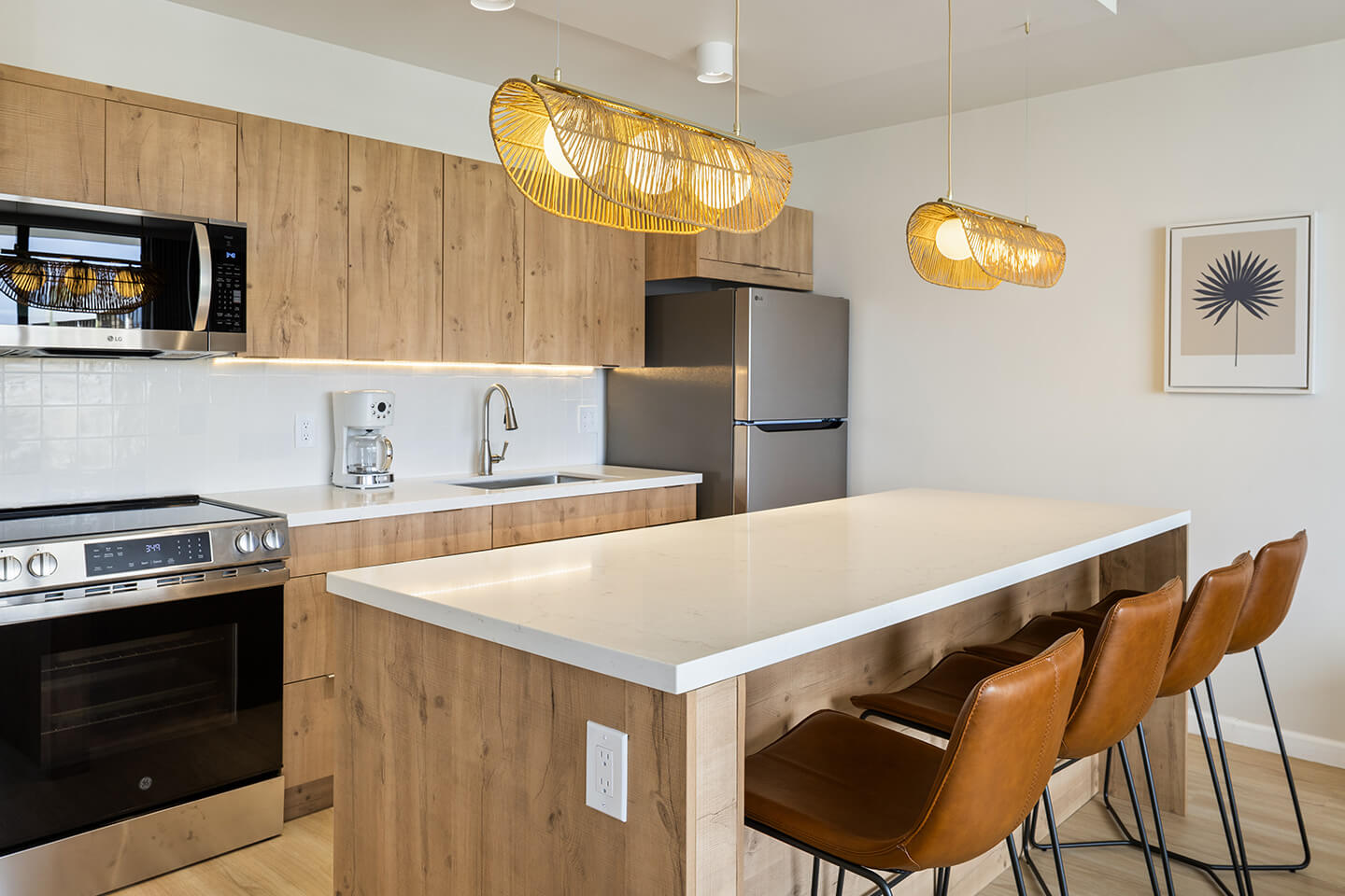 Kitchen with kitchen island and barstools.