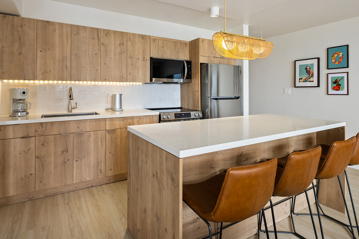 Kitchen with kitchen island and barstools.