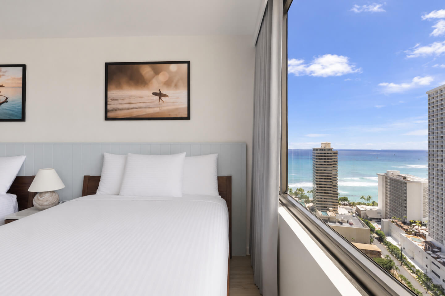 Bedroom with two queens and partial ocean view.
