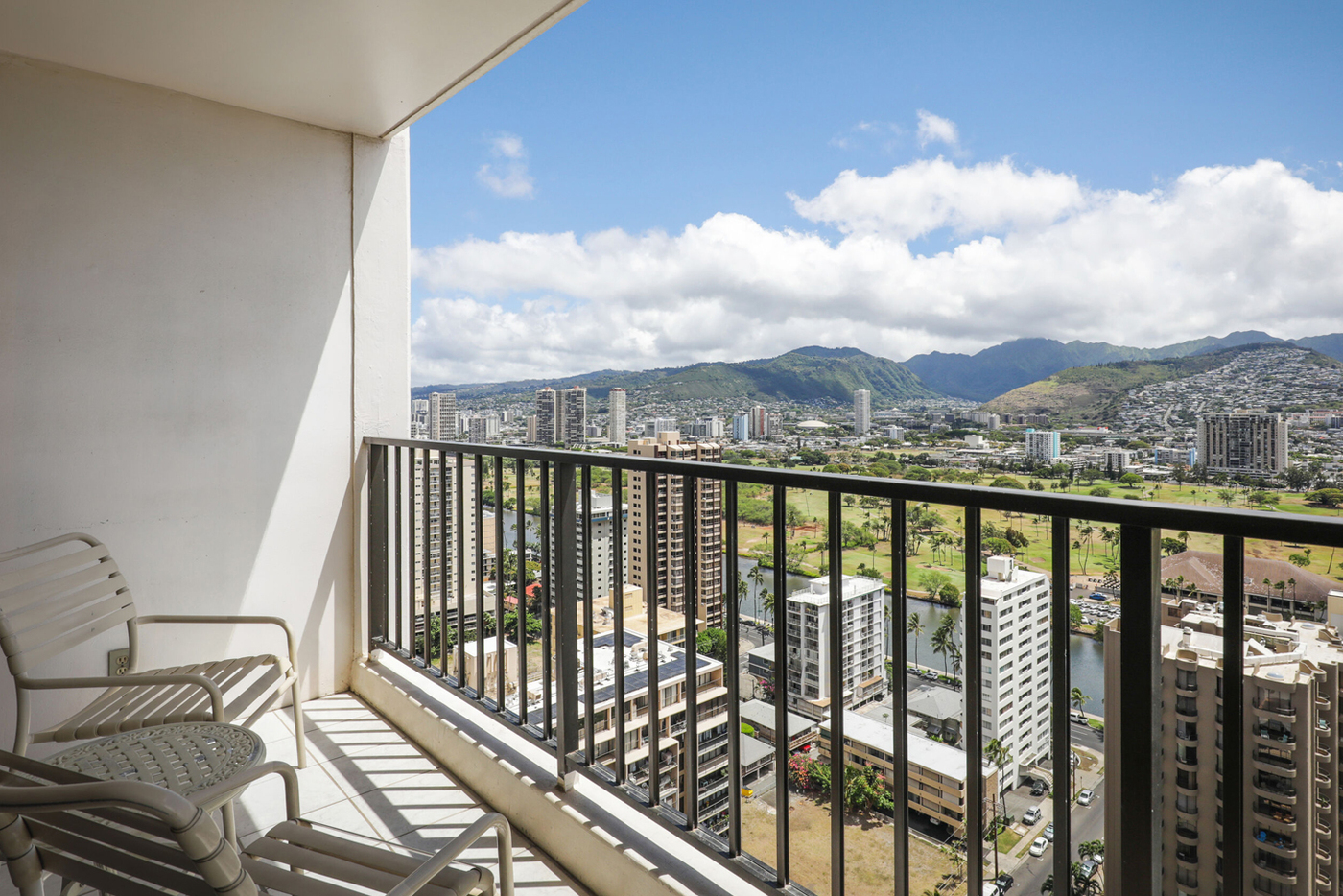 1-Bedroom Deluxe Mountain View with private balcony overlooking surrounding area.