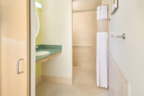 Roll-in shower accommodations for accessibility