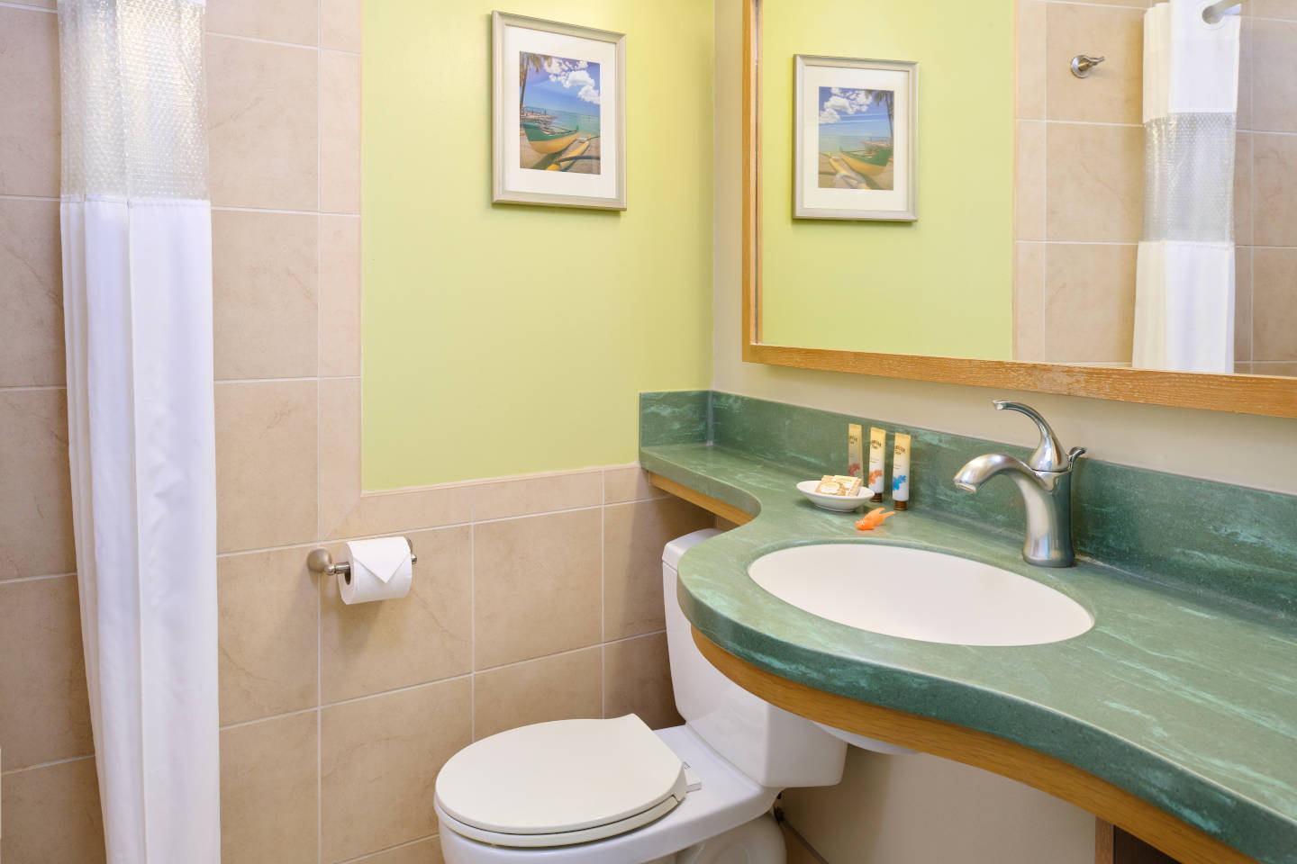 Oceanfront Room Bathroom and bathroom amenities at the Aston Waikiki Circle Hotel