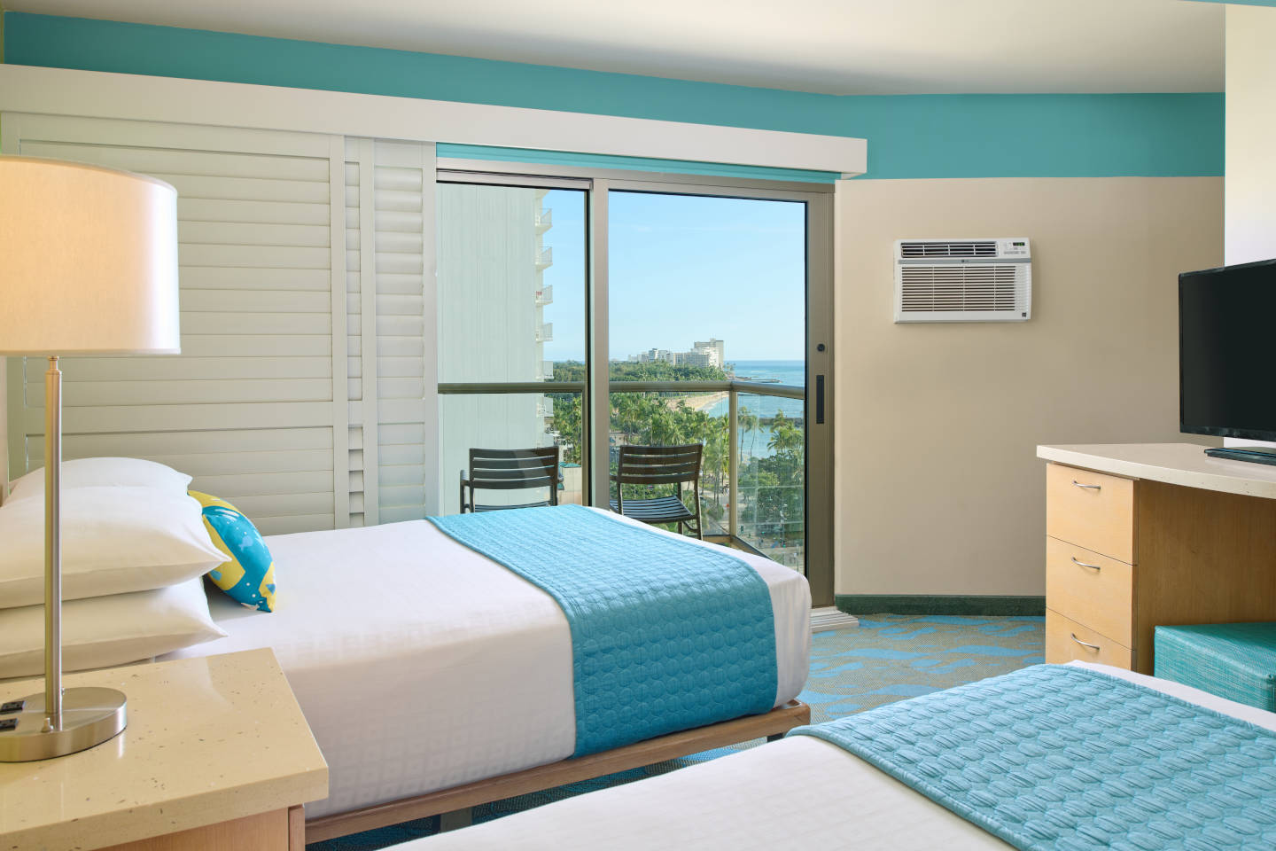 Ocean View Room accommodations with double beds, balcony and plantation shutters