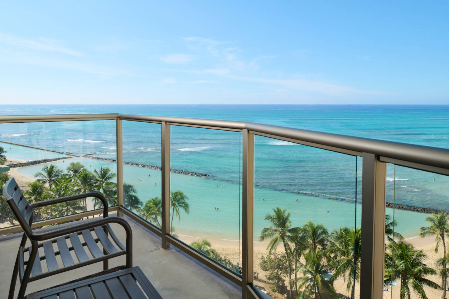 Unobstructed views of Waikiki Beach from the balcony of this Oceanfront Deluxe Accessible room at Aston Waikiki Cicle Hotel
