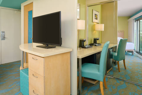 Hotel Room Amenities includes television and desk seating area 