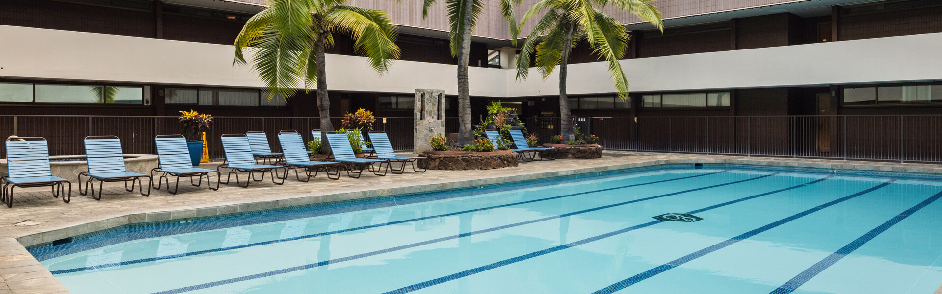 Recreation deck with pool, seating and a hot tub.