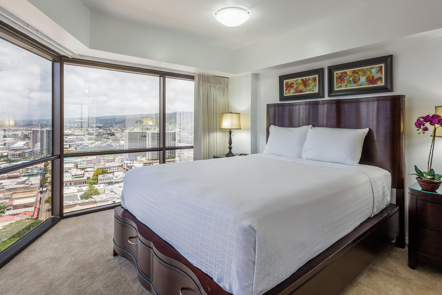 Living area with couch, dining area, TV, harbor views