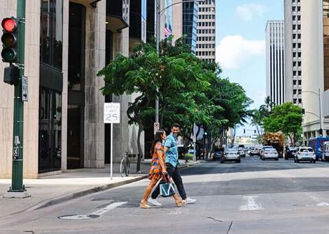 Couple walking through Downtown Honolulu