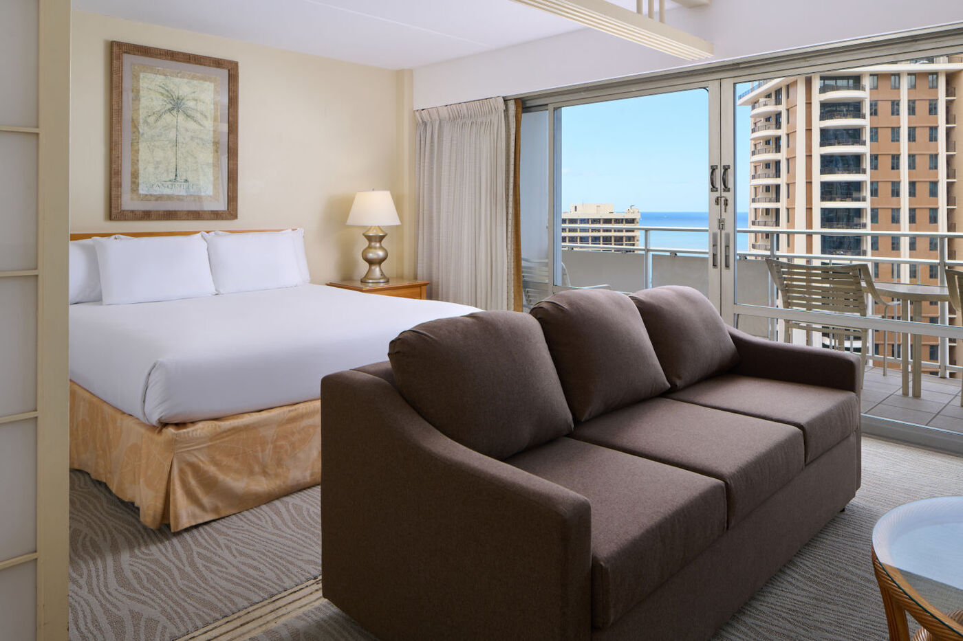 Ocean View Jr Suite with a bed and a private balcony with a beautiful views of the beach / ocean 