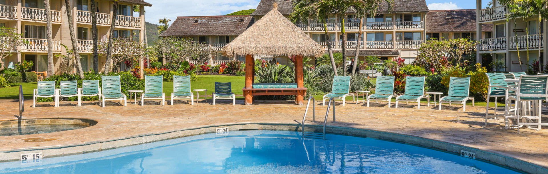 Aston Islander on the Beach swimming pool, lounge chairs on the deck and a jet spa  