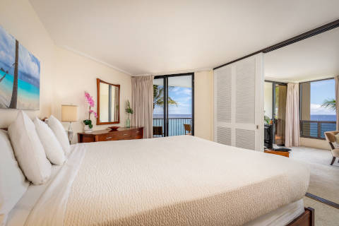 Two-Bedroom Oceanfront Master Bedroom with king size bed and sliding doors to living room 
