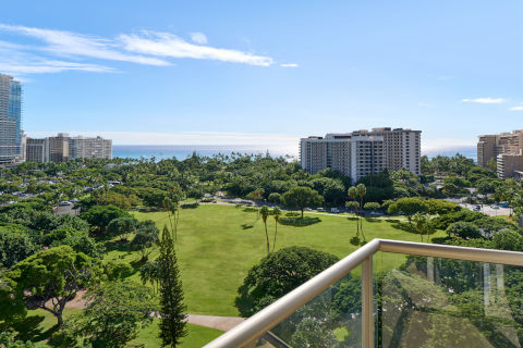 Luana Waikiki Hotel and Suites one-bedroom oceanview private balcony with views of the park and ocean view in the horizon