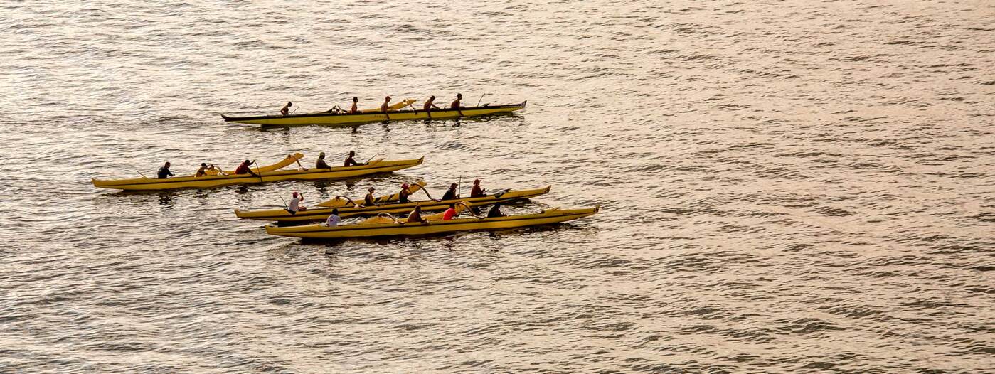 Overhead view of canoe paddlers on ocean