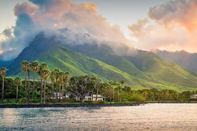 Aerial view of resort, mountains, and beachfront