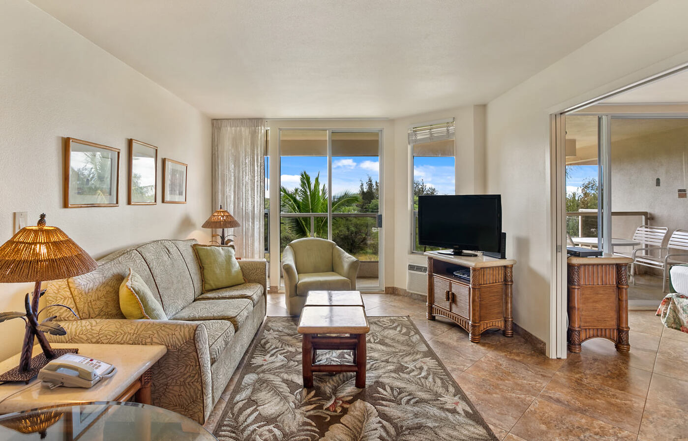 One-Bedroom Deluxe Partial Ocean View Suite Living Are