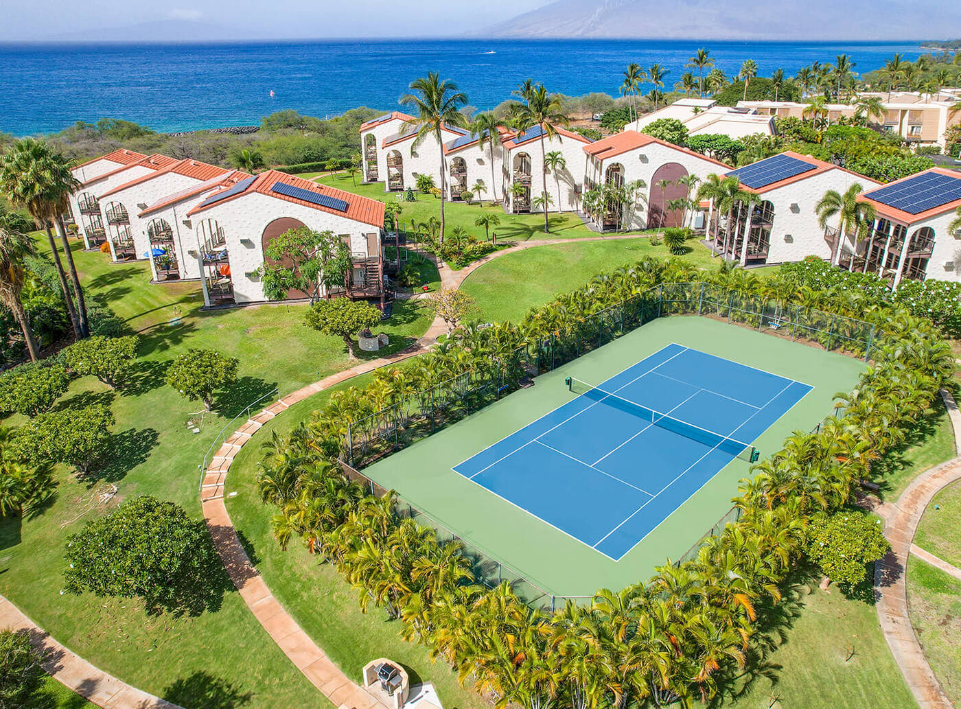 Aerial view of tennis court and resort