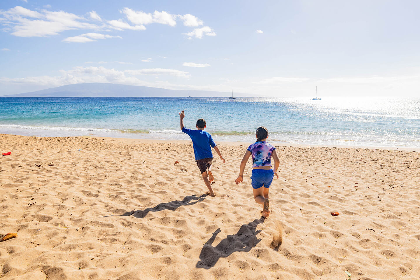 Children running on the beach