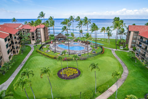 Aerial View of Resort lawn and pool out to the ocean
