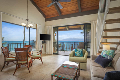 Two Bedroom Oceanfront Living Room with seperate seating space, dining area, and views of the ocean 