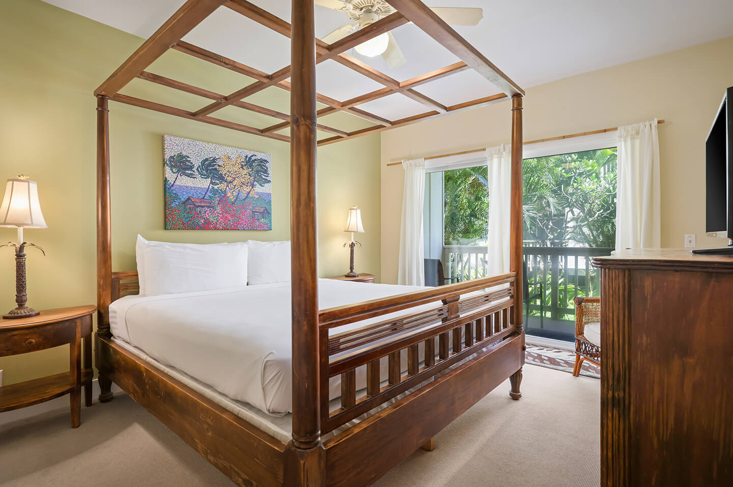 Loft room with a bed and ceiling fan.