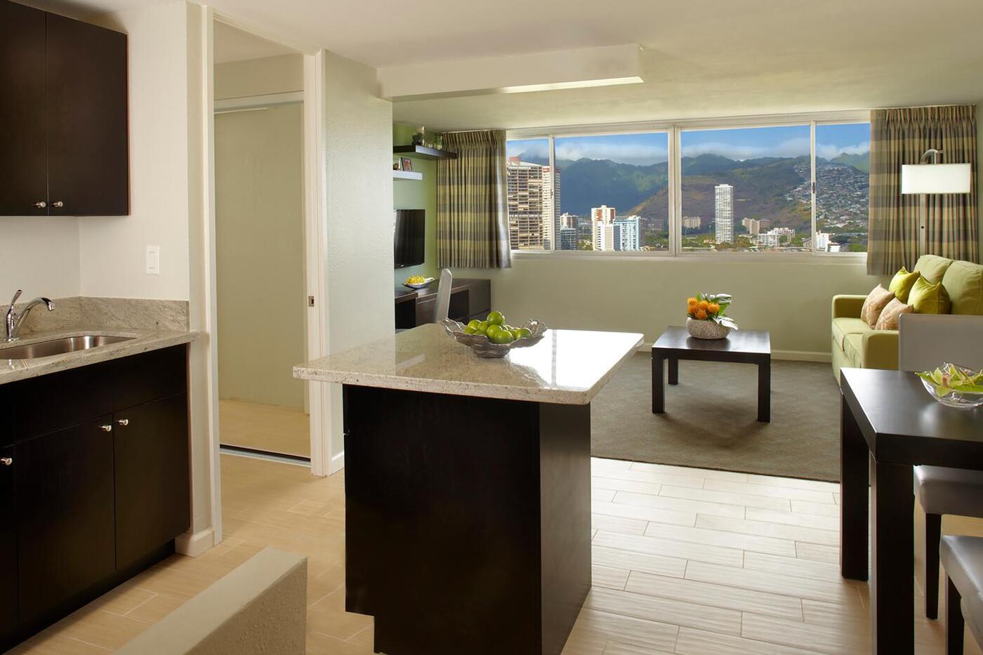 One-Bedroom Suite Panoramic City Kitchen and Living Area