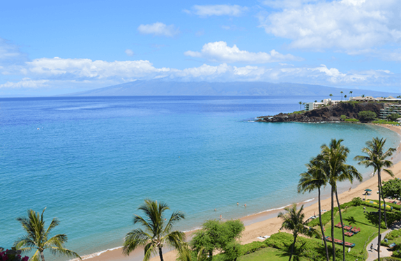 Aerial view of sandy Kaanapali Beach and neighboring island