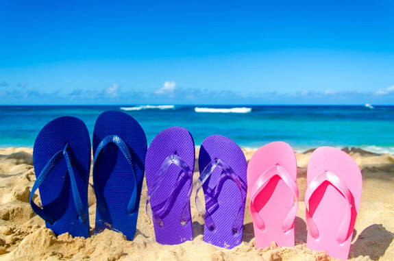 ss_292520942-slippers_in_sand_beach-767.jpg